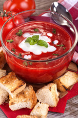 delicious homemade tomato soup with cream and basil
