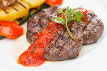 Grilled steak with baked vegetables