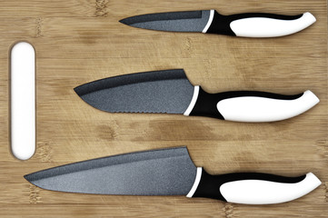 Kitchen knifes on wooden cutting board