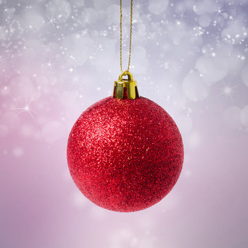 Red Christmas ball with starry background