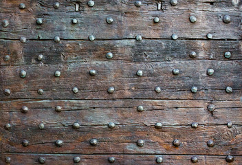 The old wooden surface with metal knobs