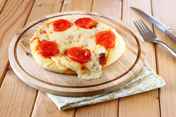 Mini pizza. homemade on wooden plate
