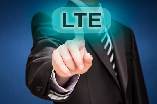 businessman pushing finger on lte button