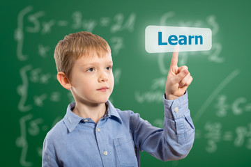 Child touching a button on a touchscreen