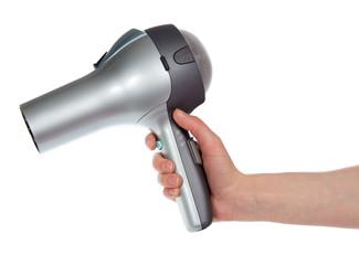 The hair dryer in a hand