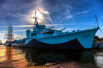 Warship in the port of dramatic scenery. Gdynia, Poland.