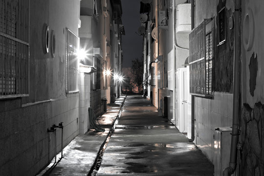 Dark back alley on a wet night
