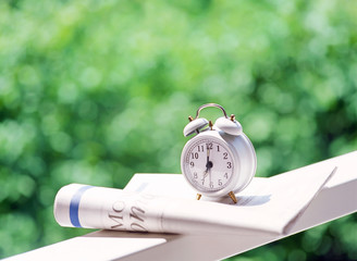 alarm clock and newspaper