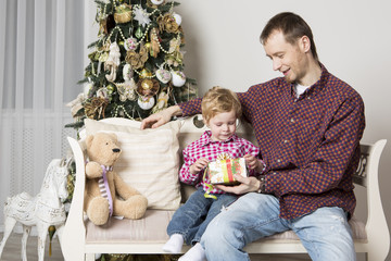 Father gives his son Christmas gift