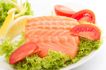 Raw salmon fillet with vegetables