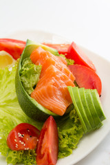 Raw salmon fillet with vegetables