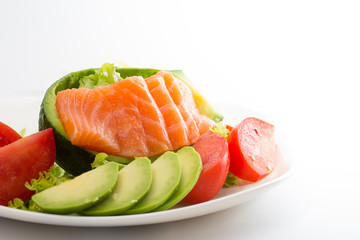 Raw salmon fillet with vegetables