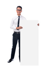 Young businessman holding blank billboard