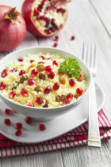 Couscous with pomegranate, raisins and spices