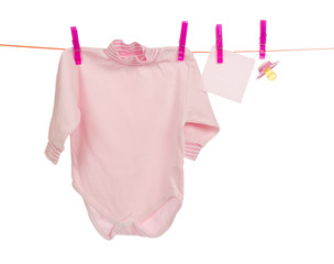 Baby clothes drying on the rope