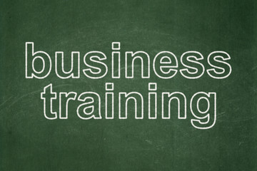 Fototapeta premium Education concept: Business Training on chalkboard background