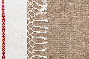 Burlap background bordered by country cloth