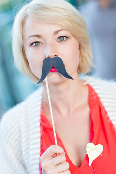 Woman with fake mustache.