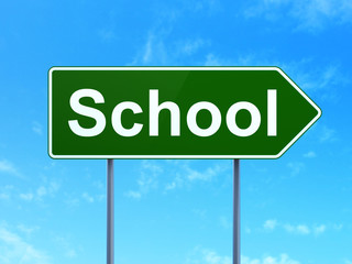 Education concept: School on road sign background