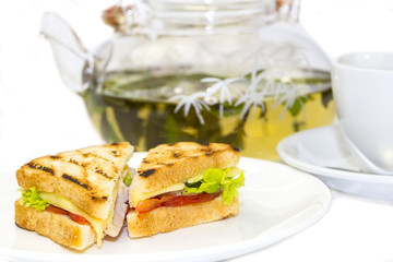 sandwich with tea on a white background in restaurant