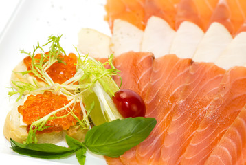 cutting of the fish on the table in a restaurant