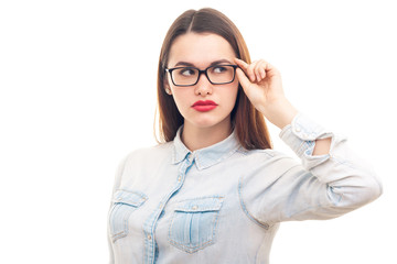 Young girl in glasses on white background