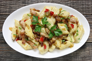 Potato dumplings with fried bacon