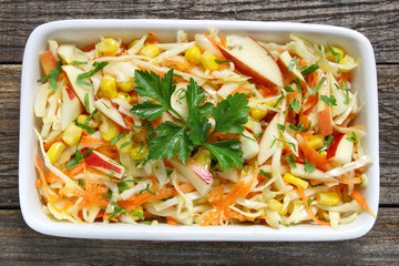 Salad with fresh cabbage,corn,apple and carrots