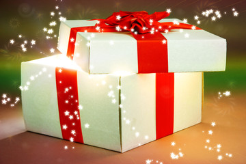 Gift box with bright light on it on bright background