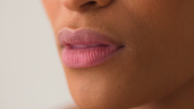 African American woman's lips smiling