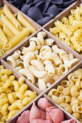 Italian pasta assortment of different colors background