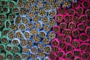 Close up view of a pile of colorful incense sticks.