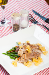 sliced pork steak with french beans and apple diced sauce