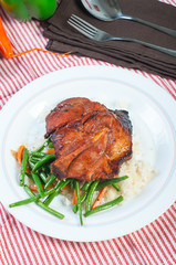pork barbecue steak with french beans and carrots on garlic rice