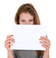 Fototapeta premium nice woman holds blank sheet of paper