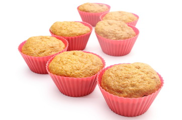 Fresh baked carrot muffins in red silicone cups