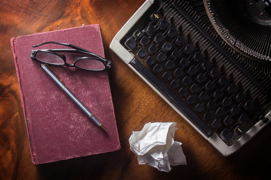 Old Typewriter With Book,pen And Eyeglasses