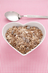 Muesli in a heart shaped bowl