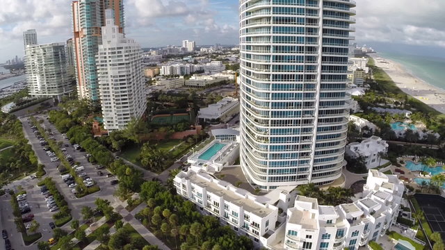 Aerial footage of Miami Beach highrise condos on the beach