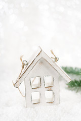 wooden house christmas decoration on white snow background