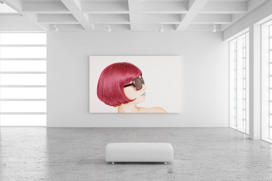Empty exhibition hall with picture of a woman