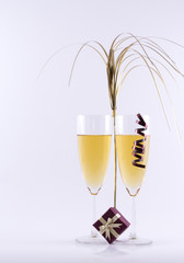 Glass with champagne and ornaments