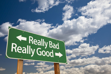 Really Bad, Really Good Green Road Sign and Clouds