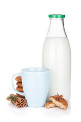 Cup, bottle of milk and cookies