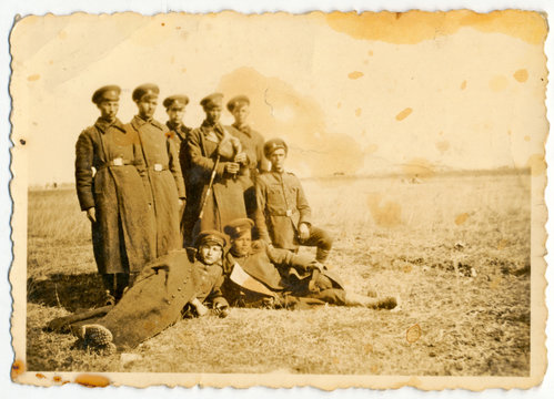 CIRCA 1945: A group of soldiers posing on a field