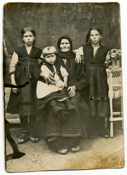 CIRCA 1930: Traditional family in period dress, Bulgaria