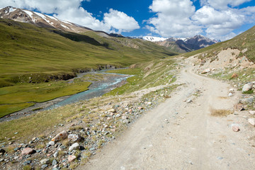 Road along the mountain river Jil-Suu
