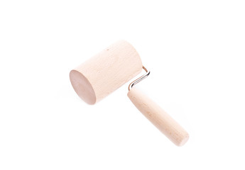 Wooden rolling pin on white background