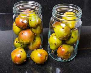 Spiced seckel pears being preserved