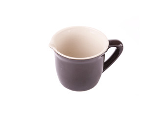 A pottery pitcher of milk on white background